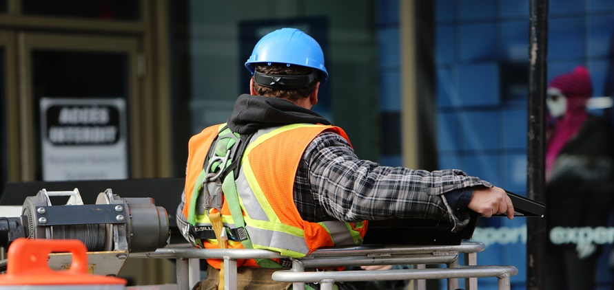 Worker operating a lift truck